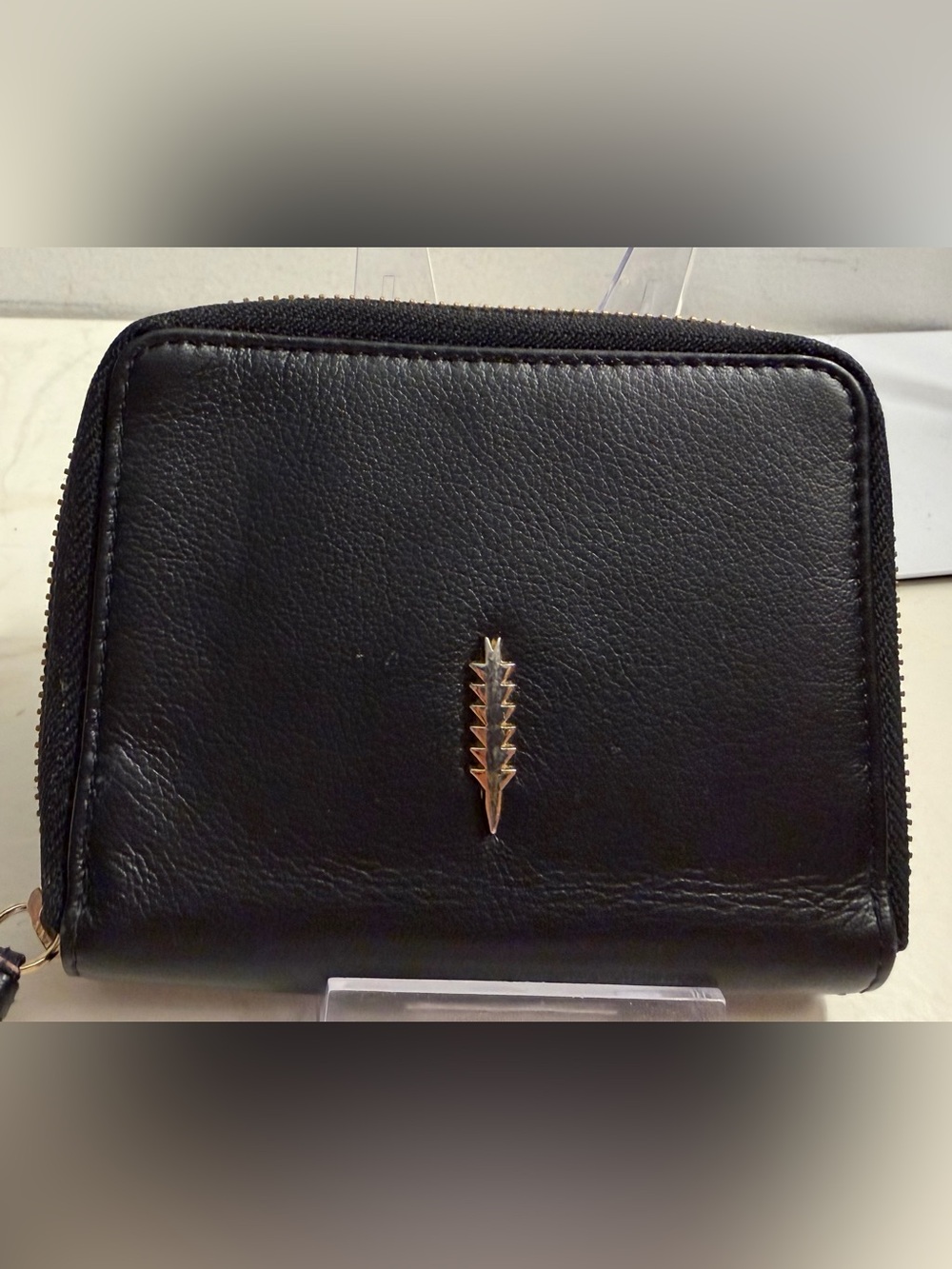Thacker bifold black leather wallet.